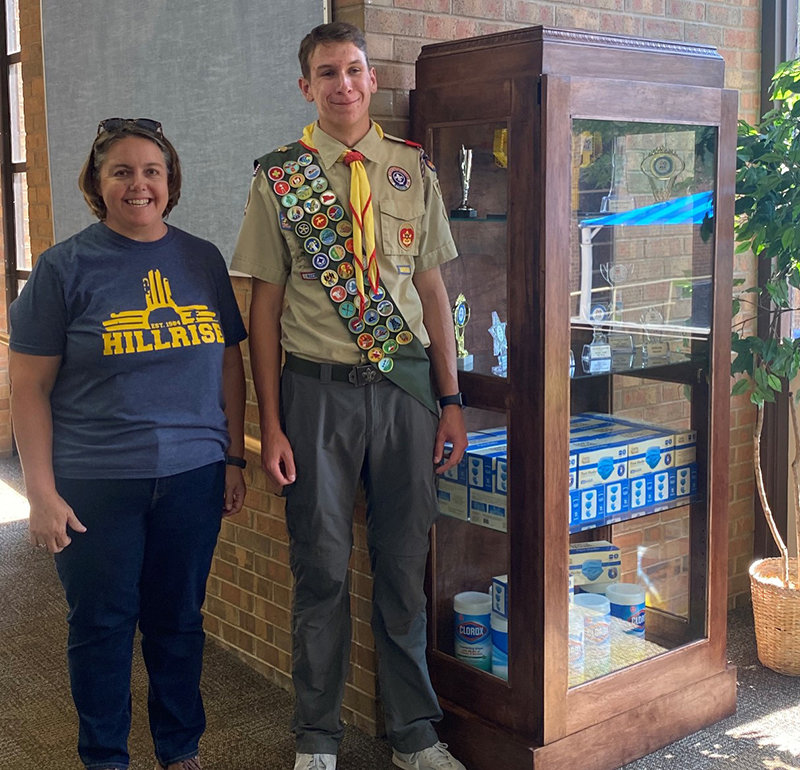 Boy Scouts of America Troop 180 Eagle Scout Liam Rutherford and Hillrise Elementary School Principal Karin Hite with the trophy case Liam built for Hillrise Elementary School as his Eagle Scout project.