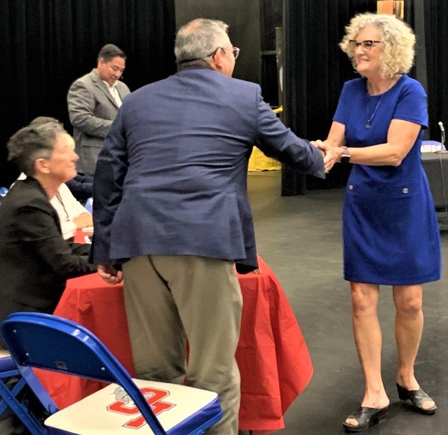 Pamela Cort receives a congratulatory handshake from LCPS Superintendent Ralph Ramos after being appointed to fill the District 2 seat on the LCPS Board of Education.