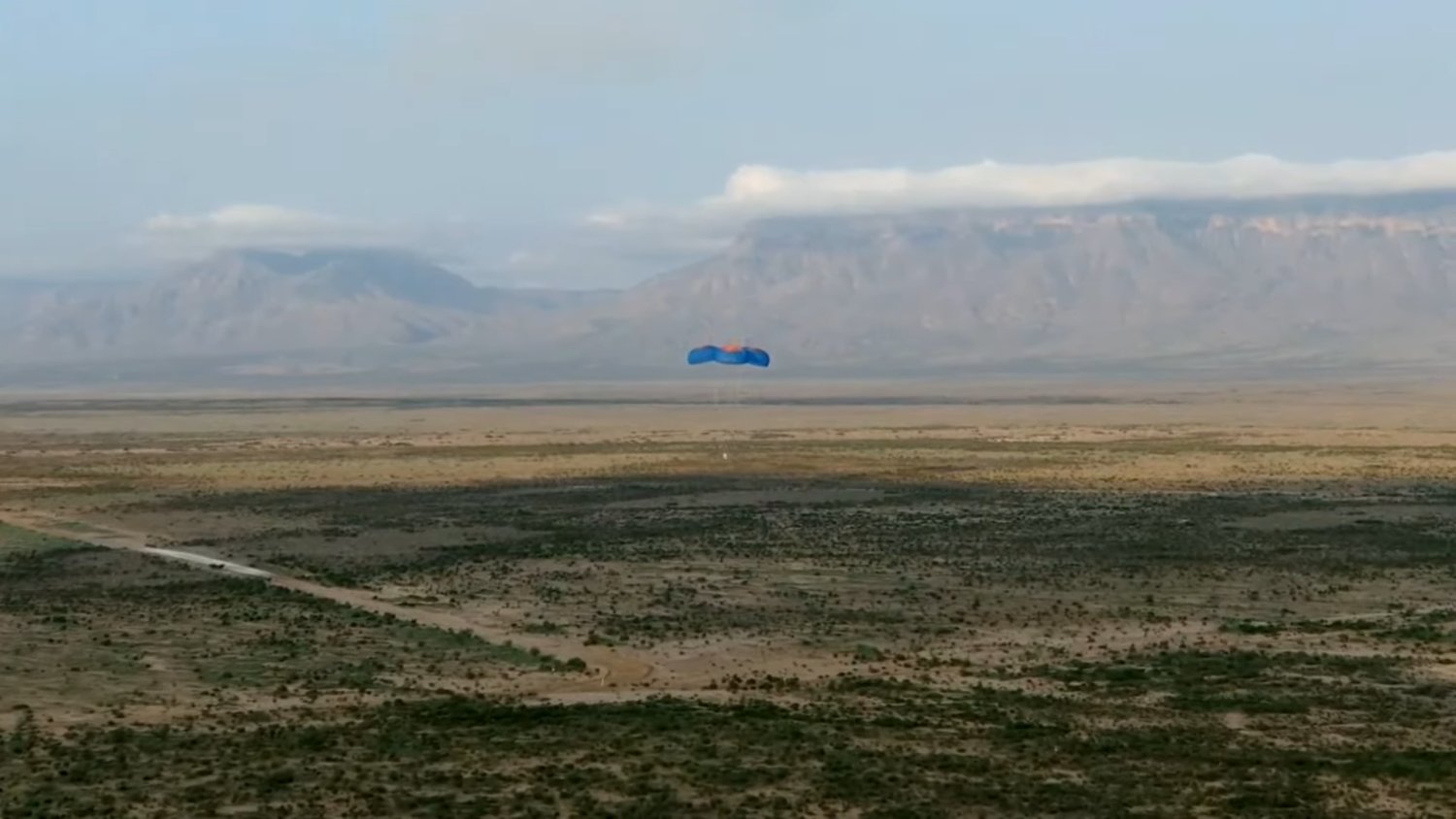 The New Shepard capsule lands softly in the West Texas desert returning from a historic flight setting  several records including that of the first commercial vehicle to fly paying customers, including payloads and astronauts, to space and back.