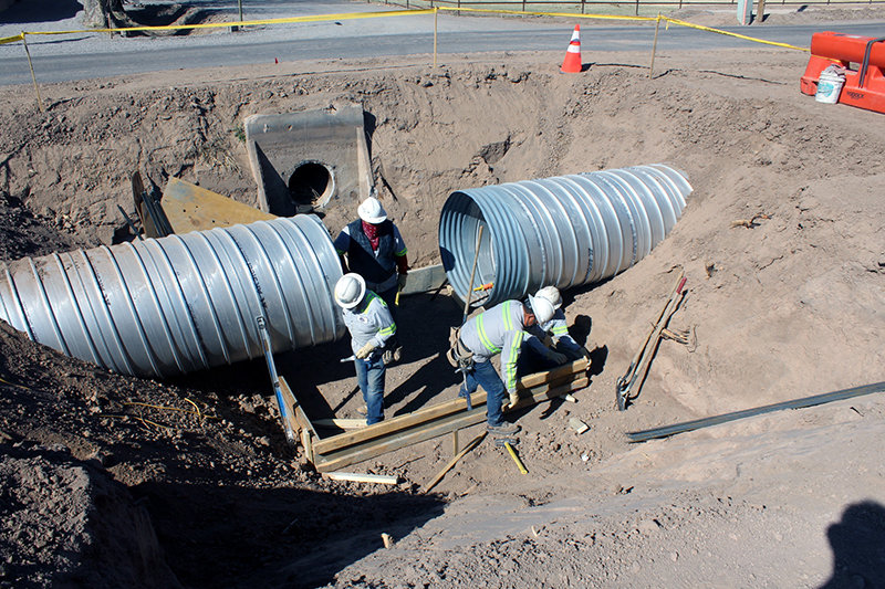 Elephant Butte Irrigation District crew works on footing for a distribution box on the Picacho pipeline.