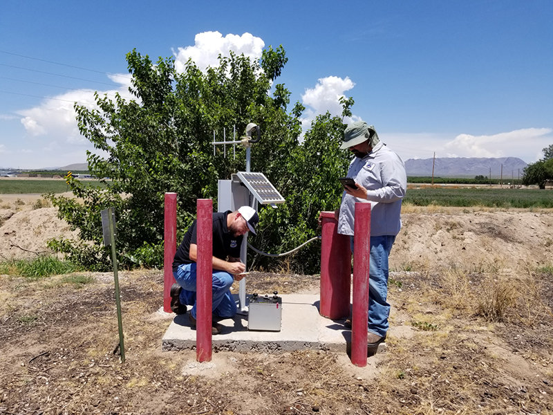 Patrick Lopez and Adam Carrejo collect gravity readings from an Elephant Butte Irrigation District groundwater monitoring well using a ZLS gravity meter. EBID will use this data to track change in storage of the aquifer at different points of the year.