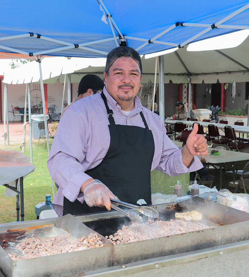 Luis Cardona making tacos at a recent Franciscan Festival of Fine Arts.