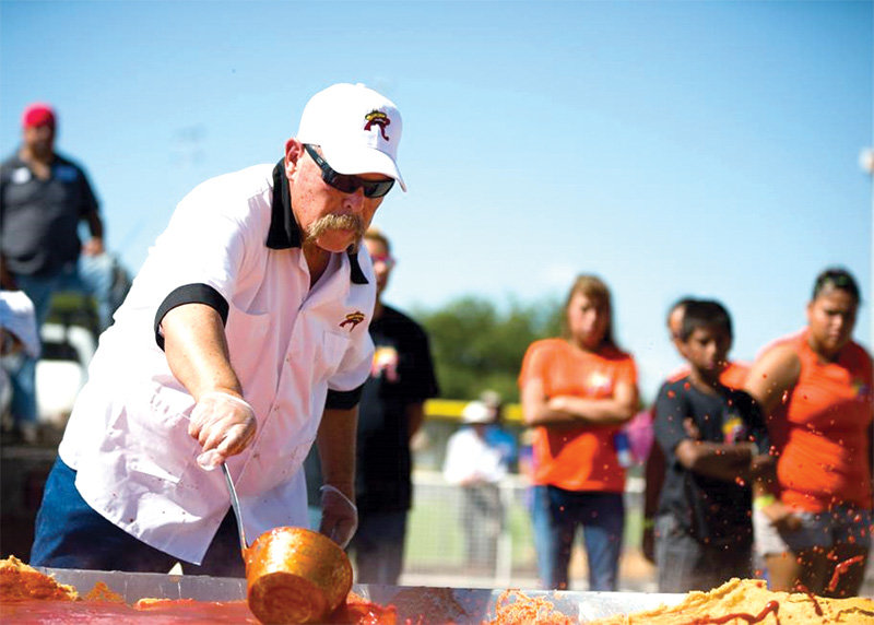 Roberto Estrada builds the world's biggest enchilada at the Whole Enchilada Fiesta.