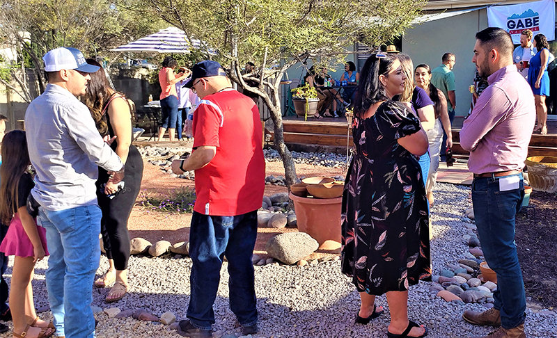 Las Cruces City Councilor Gabe Vasquez, far right, chats with Doña Ana County Clerk Amanda Lopez Askin Saturday, Sept, 18, at Vasquez’s announcement celebration as he declared his candidacy for New Mexico’s Second Congressional District.
