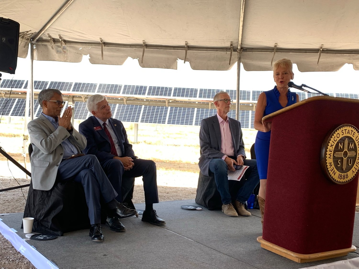 El Paso Electric President and CEO Kelly Tomblin speaks at the opening event for Aggie Power Sept. 23. Seated behind Tomblin are Lakshmi Reddi, dean of the College of Engineering; NMSU Chancellor Dan Arvizu; and Wayne Savage, executive director of the Arrowhead Research Park.