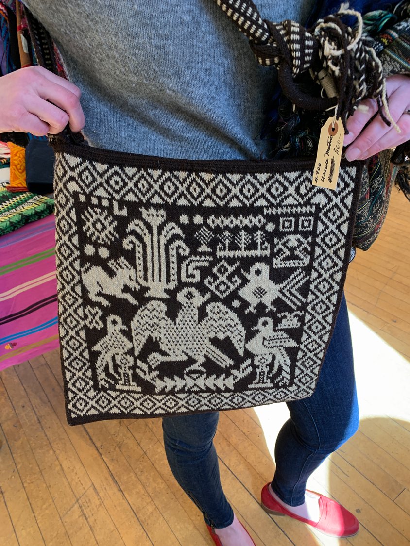 A woven wool shoulder bag from Nahuala, Guatemala.