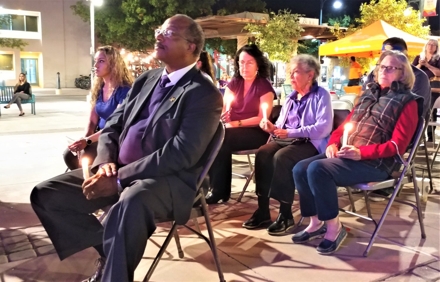 Third Judicial District Attorney Gerald Buyers of Las Cruces holding a candle in honor of victims of domestic violence at La Casa’s 24th annual Candlelight Vigil, held Oct. 21 at Plaza de Las Cruces.