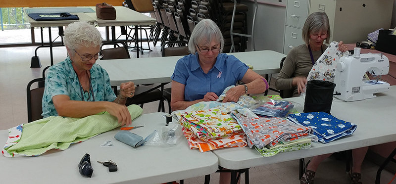 Left to right are Project Linus volunteers Diana Gibson, Earlene Brookshire and Annalee Berstein.