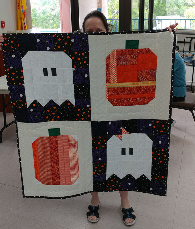 A Halloween quilt displayed by Project Linus volunteer Kathy Valdez.