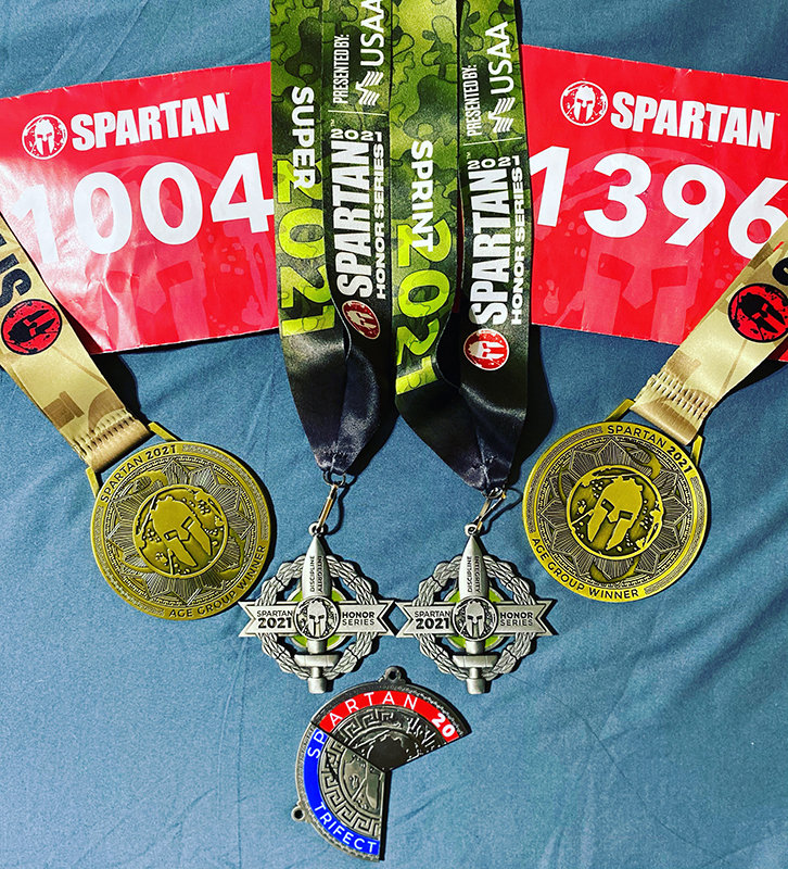 The awards Nathan Hidalgo won – two first place awards in his age group – at the Spartan Race event held in March 2021 in San Antonio, Texas.