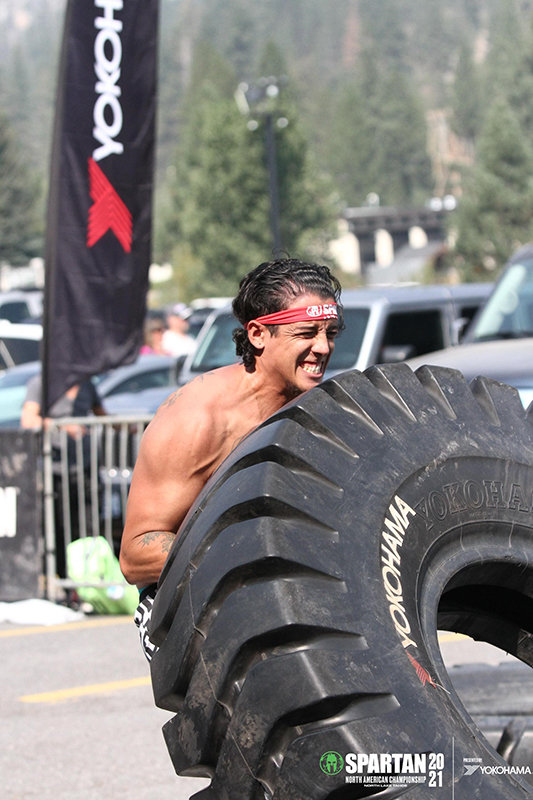 Nathan Hidalgo competing in the tire flip obstacle event in the Spartan North American Championship held Sept. 25, 2021, in North Lake Tahoe, California.