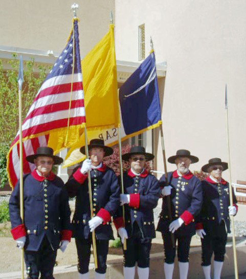 The New Mexico Society Color Guard prepares to parade flags of the United States, New Mexico and the Sons of the American Revolution (SAR) on Flag Day, last June 14, in Santa Fe. Color Guard members Jim Thornton, Jimmie Fennell, Charles Martinez, Lionel Rael, and George Garcia are dressed in the Spanish Presidio Soldiers Uniform of 1780.