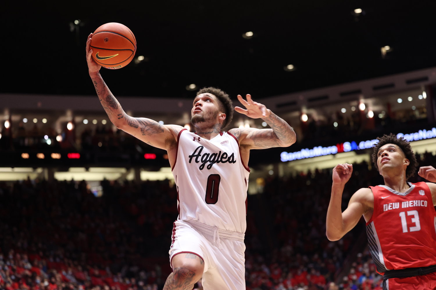 New Mexico State’s Teddy Allen drives to the hoop against the University of New Mexico Dec. 6 in The Pit in Albuquerque.