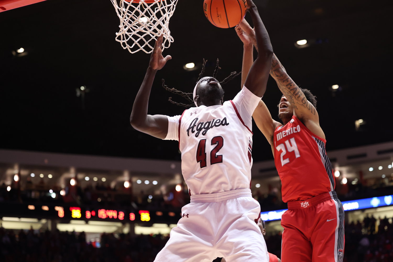 New Mexico State’s Yuat Alok battles for the ball against the University of New Mexico Dec. 6 at the Pit in Albuquerque.
