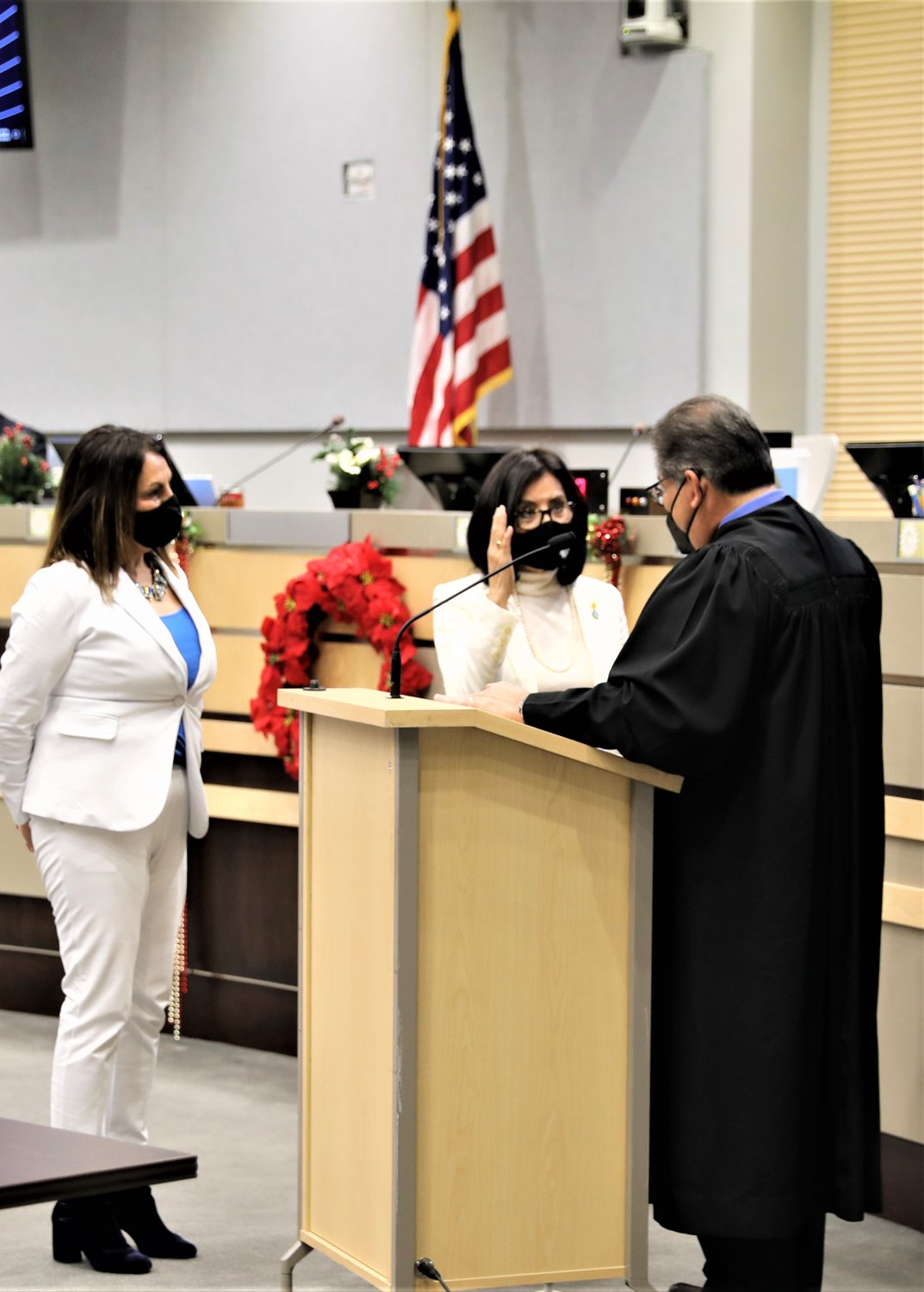 Las Cruces City Councilor Yvonne Flores was sworn in for a second four-year term on the council Dec. 21 by Third Judicial District Judge Conrad Perea. Flores is shown with Mayor Pro Tempore Kassandra Gandara.