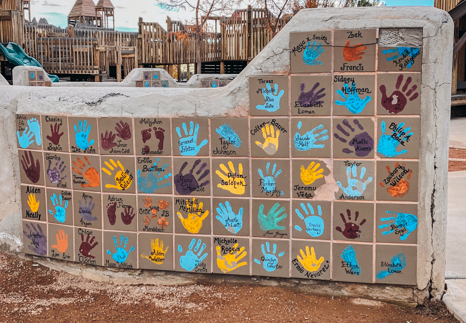 The Unidad Park wall featuring children’s handprints will be preserved as part of the park’s renovation.