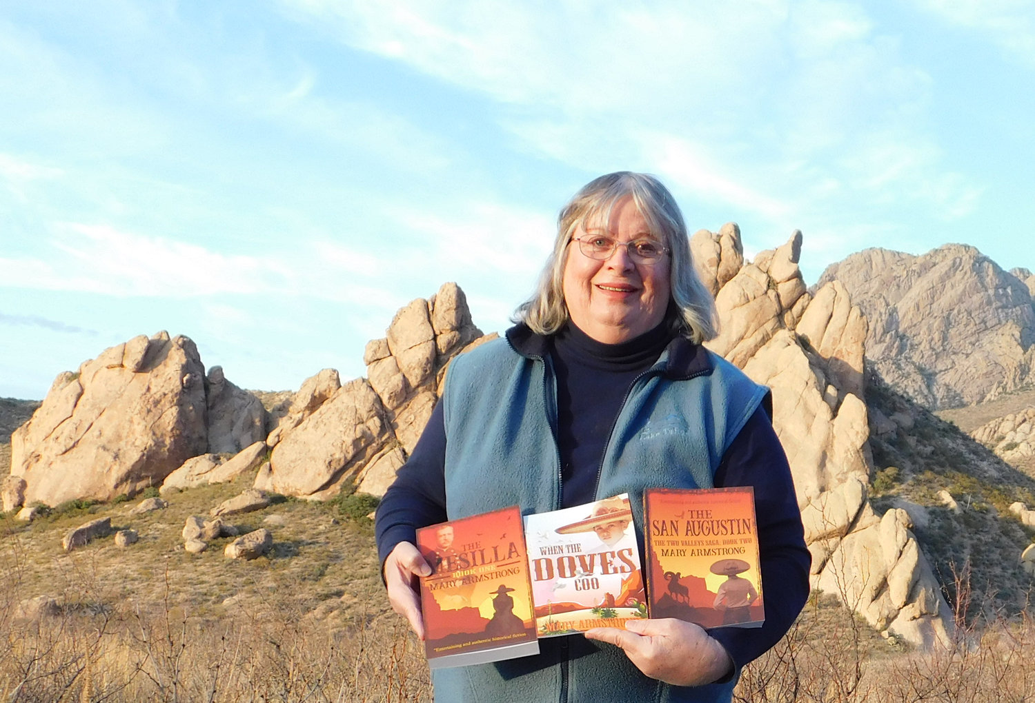 Las Cruces author Mary Armstrong shows some of her books. Her latest, “The San Augustin: The Two Valleys Saga, Book Two,” is now available.