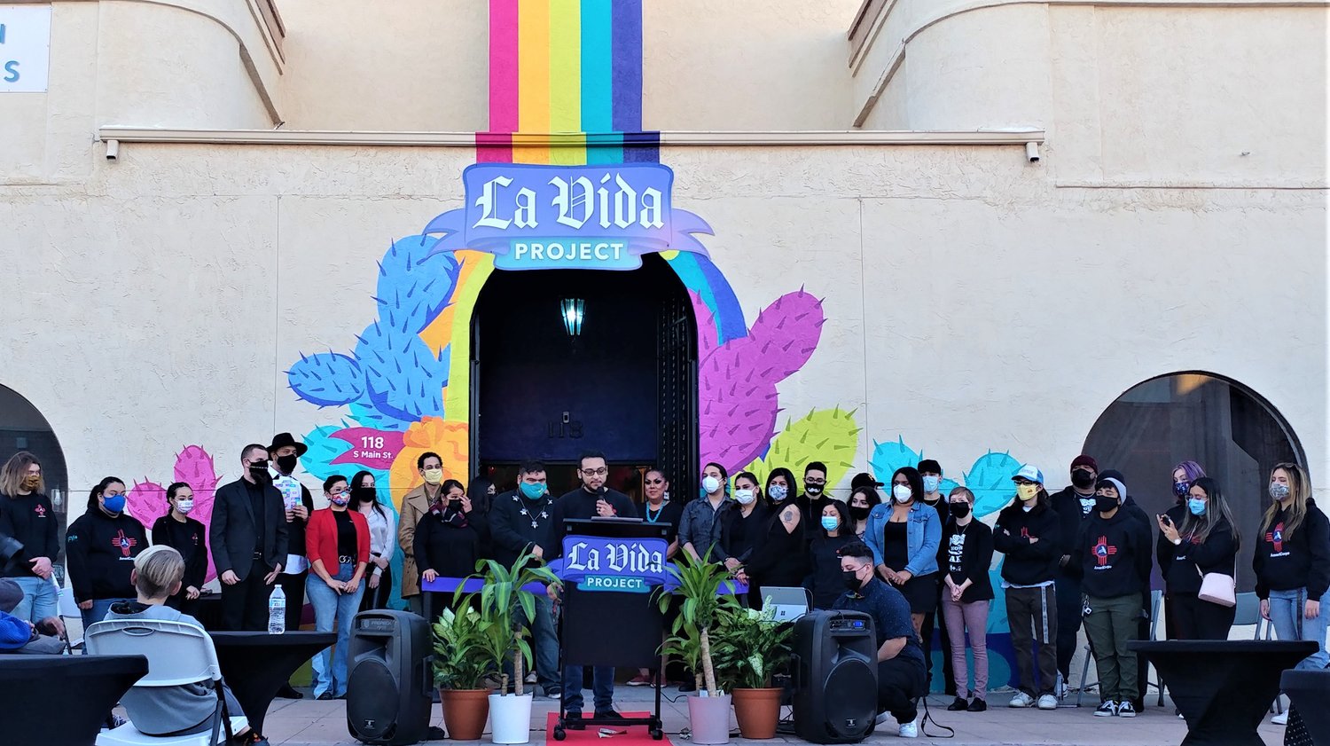 Staff and volunteers of FYI+ La Vida Project Innovative Youth Programs and Resource Center at the center’s grand opening Friday evening, Jan. 7, at 118 S. Main St. Downtown. La Vida Project team member and FYI+ Assistant AmeriCorps Supervisor Dez Serna is at the lectern.