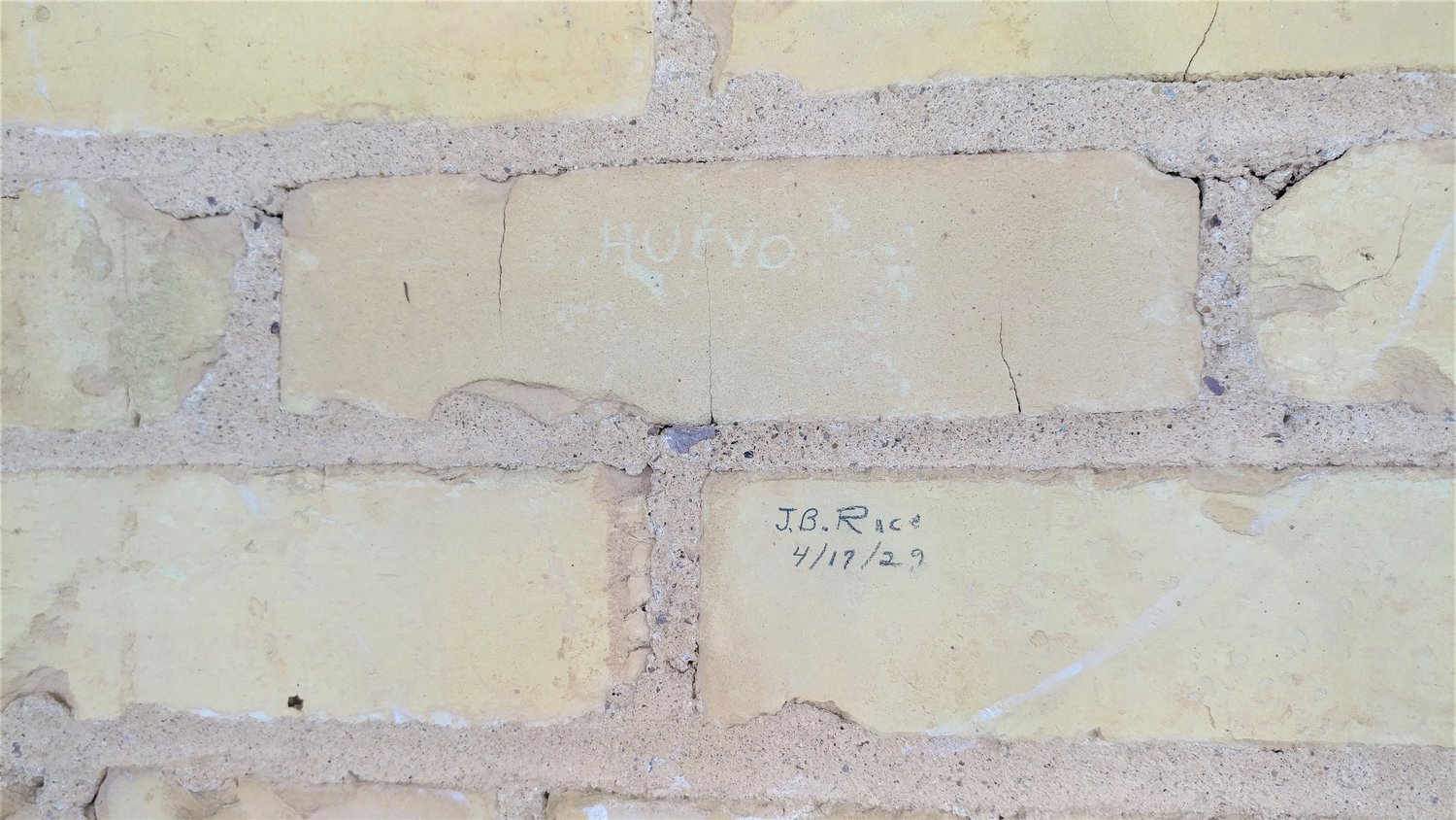 Some of the Hadley-Ludwick House’s original bricks with names written on them that may be a hundred or more years old.