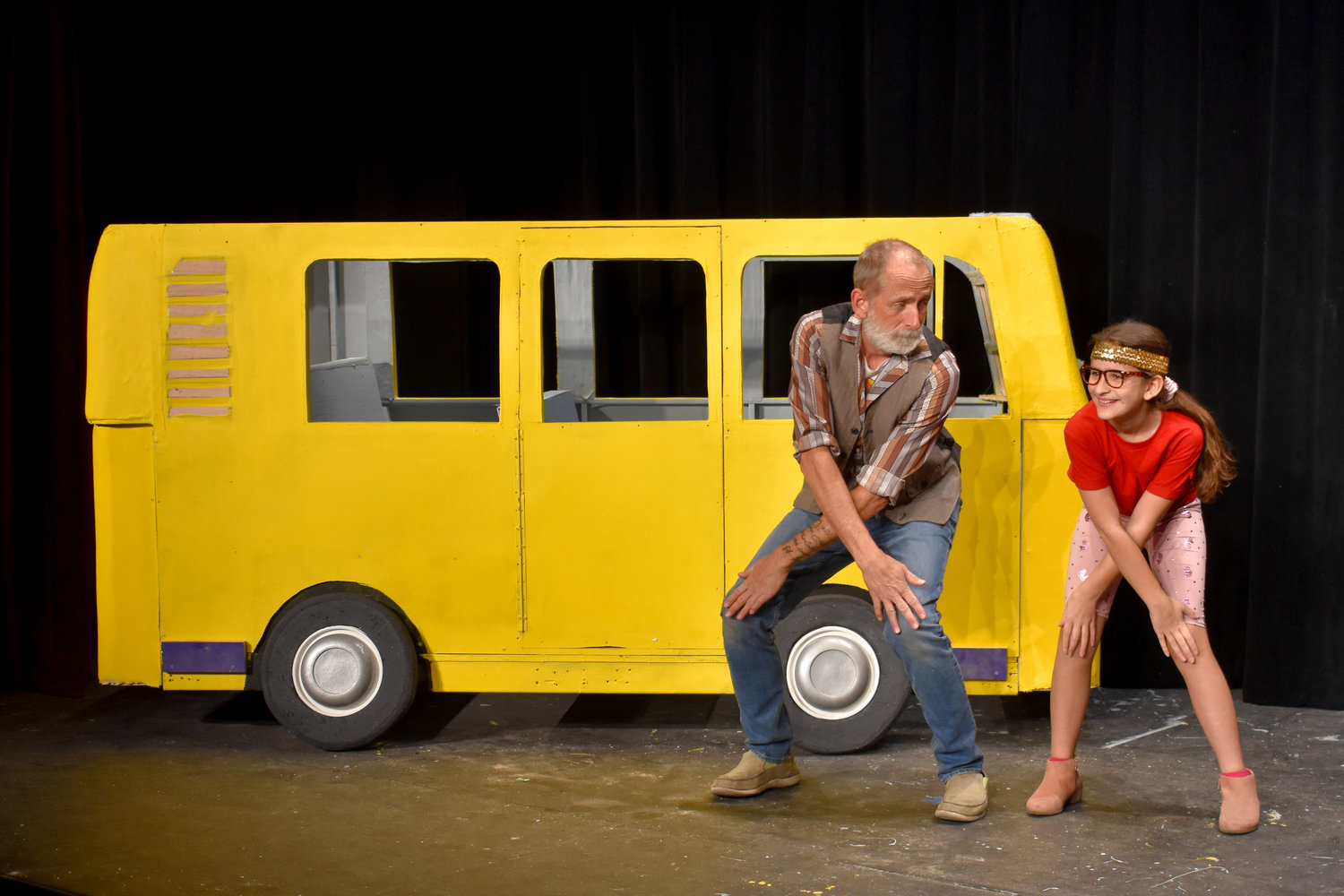 At a rehearsal of Las Cruces Community Theatre’s upcoming production of “Little Miss Sunshine” are, left to right, Brandon Brown and Kayla Bradford dancing by the van.