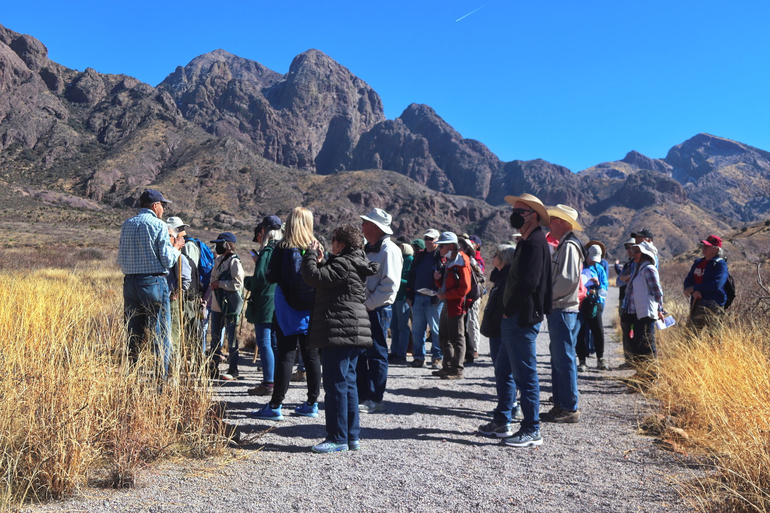 The Las Cruces chapter of The Native Plante Society of New Mexico collects hikers for a nature hike at Dripping Springs. The leader, John Freyermuth, is on the far left.