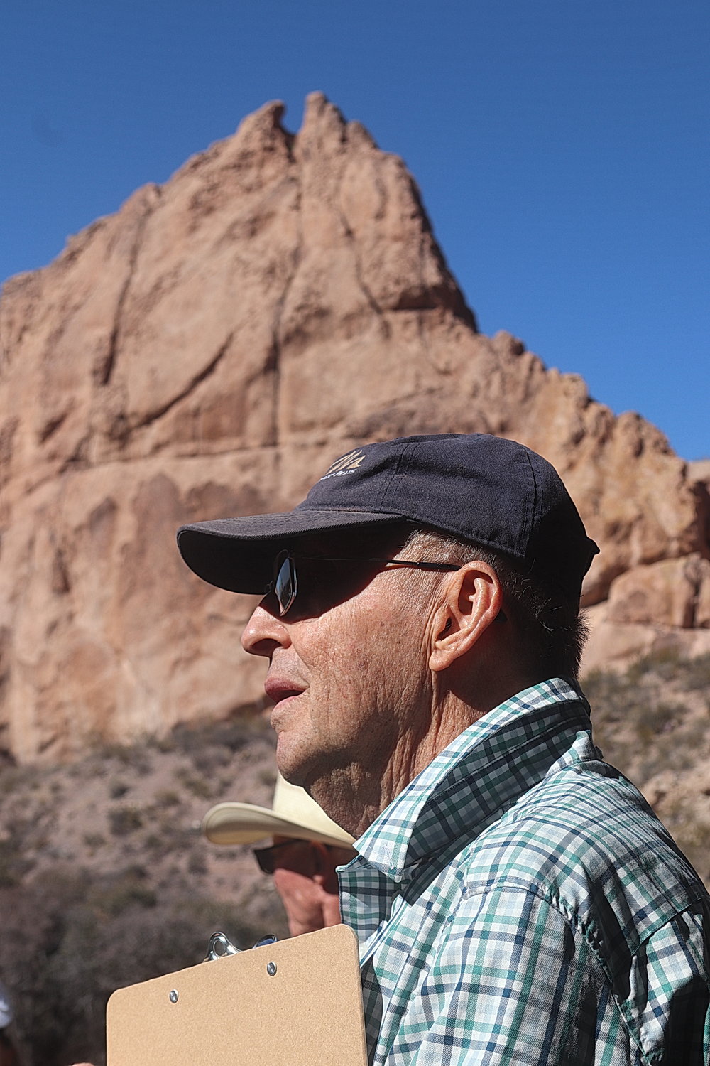 John Freyermuth, the leader of a Native Plant Society nature walk, pauses in front of La Cueva near the end of the walk.
