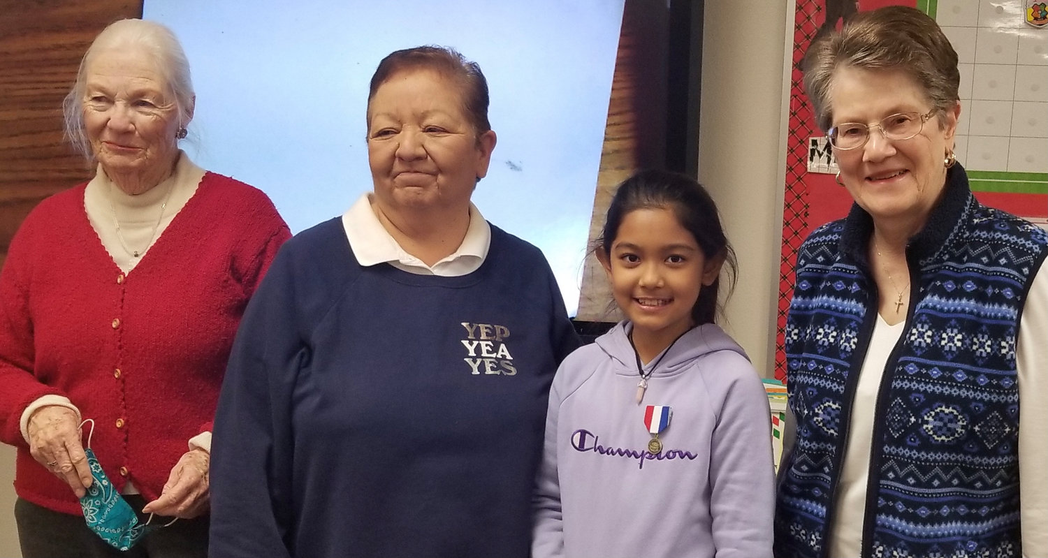 Left to right are DAR Doña Ana Chapter American History chair Bonnie Poloner, teacher Rose Mitchell, DAR essay contest fifth-grade winner Roma Subedi and DAR Doña Ana Chapter Regent Linda Bartlett.