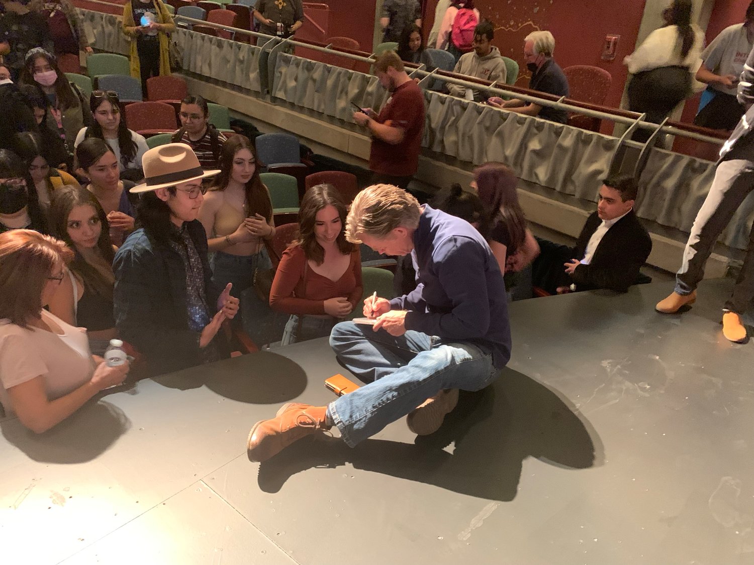 Actor William H. Macy signs items for attendees, mostly New Mexico State University students, at his March 3 event held at the Center For the Arts.