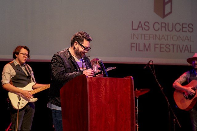 Director Alejandro Montoya accepts the 2022 Las Cruces International Film Festival’s Best Director Award for his film, “The Wrong Guy,” Saturday night at the Rio Grande Theatre.
