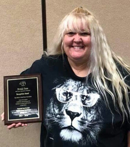 New Mexico Lions Operation KidSight, Inc. Program Manager Brenda Dunn with the special-recognition award she received from the New Mexico School Nurses Association.