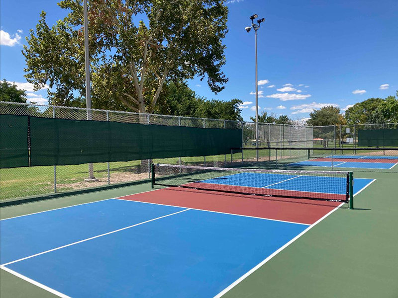 Sports court surfacing warranty work will occur on Apodaca Park Pickleball courts, Four Hills Park basketball court, and Lions Park tennis courts from March 21 through March 23, 2022.