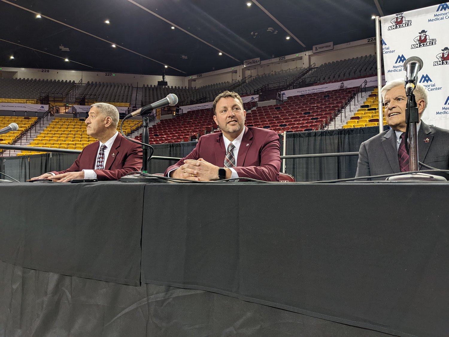 NMSU coach Greg Heiar, center, at his introductory news conference March 28.