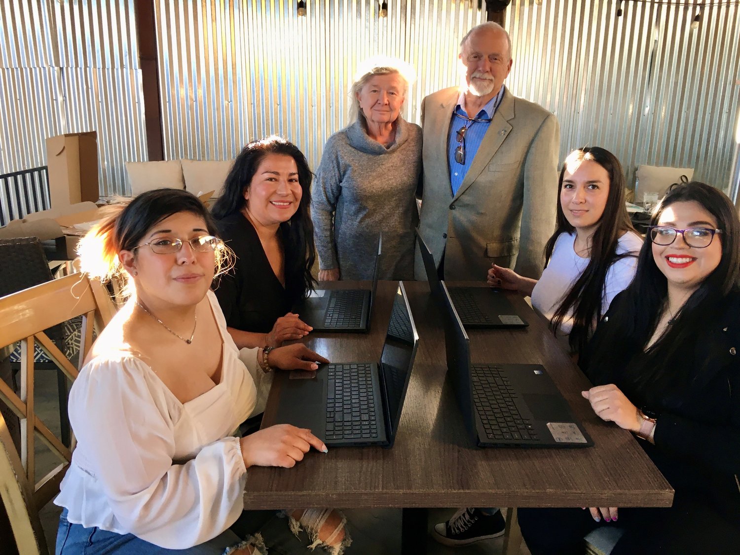 Four Live Your Dream Awardees from southern New Mexico and far West Texas check are, seated left to right, Lauren Rosales, Alex Sosa, Debbie Cantu and Victoria Trujillo. Standing are Doña Ana County Commissioner Shannon Reynolds and his wife, Maggie.