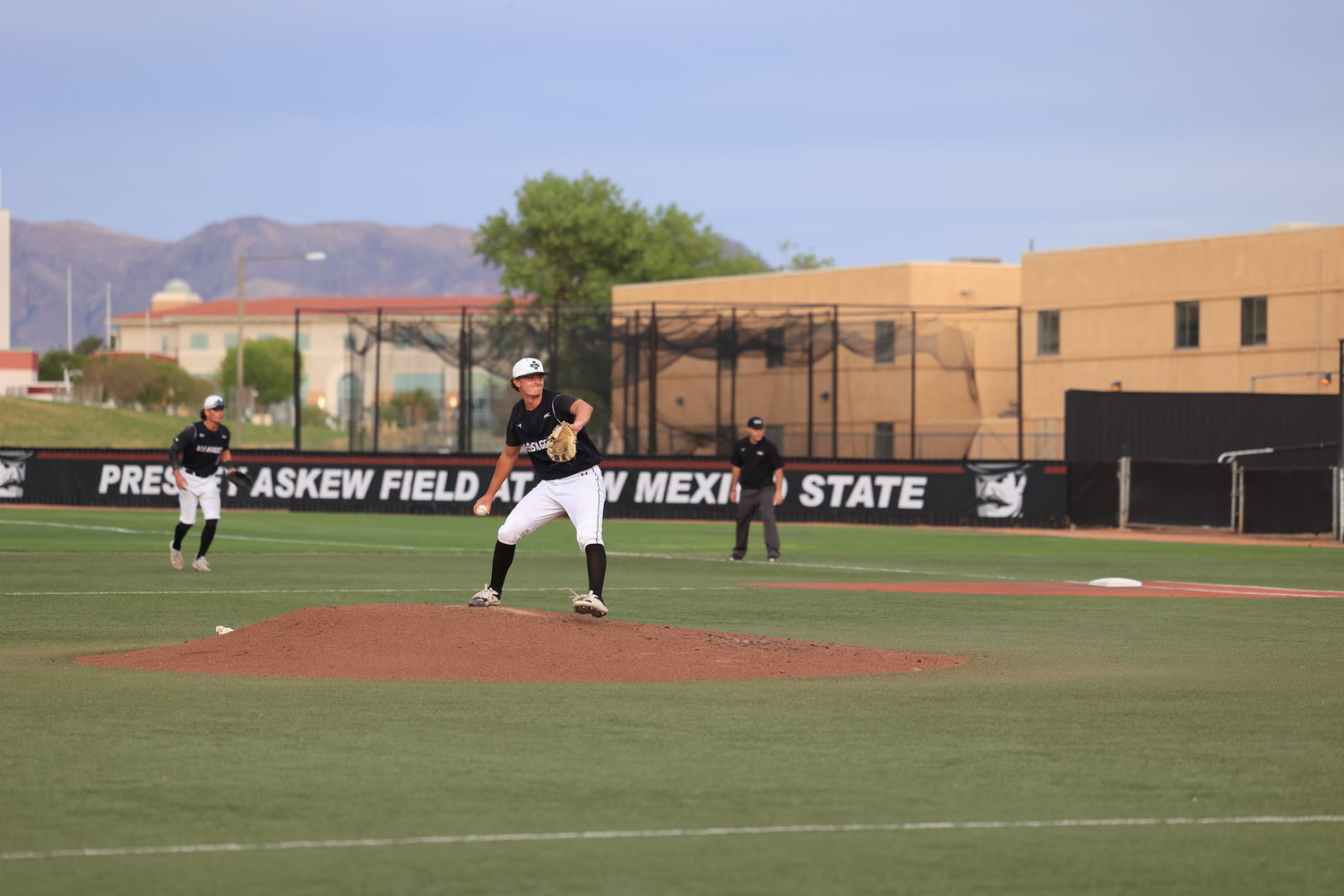 NM State's Josh Laukkanen fires a pitch at Presley Askew Field.