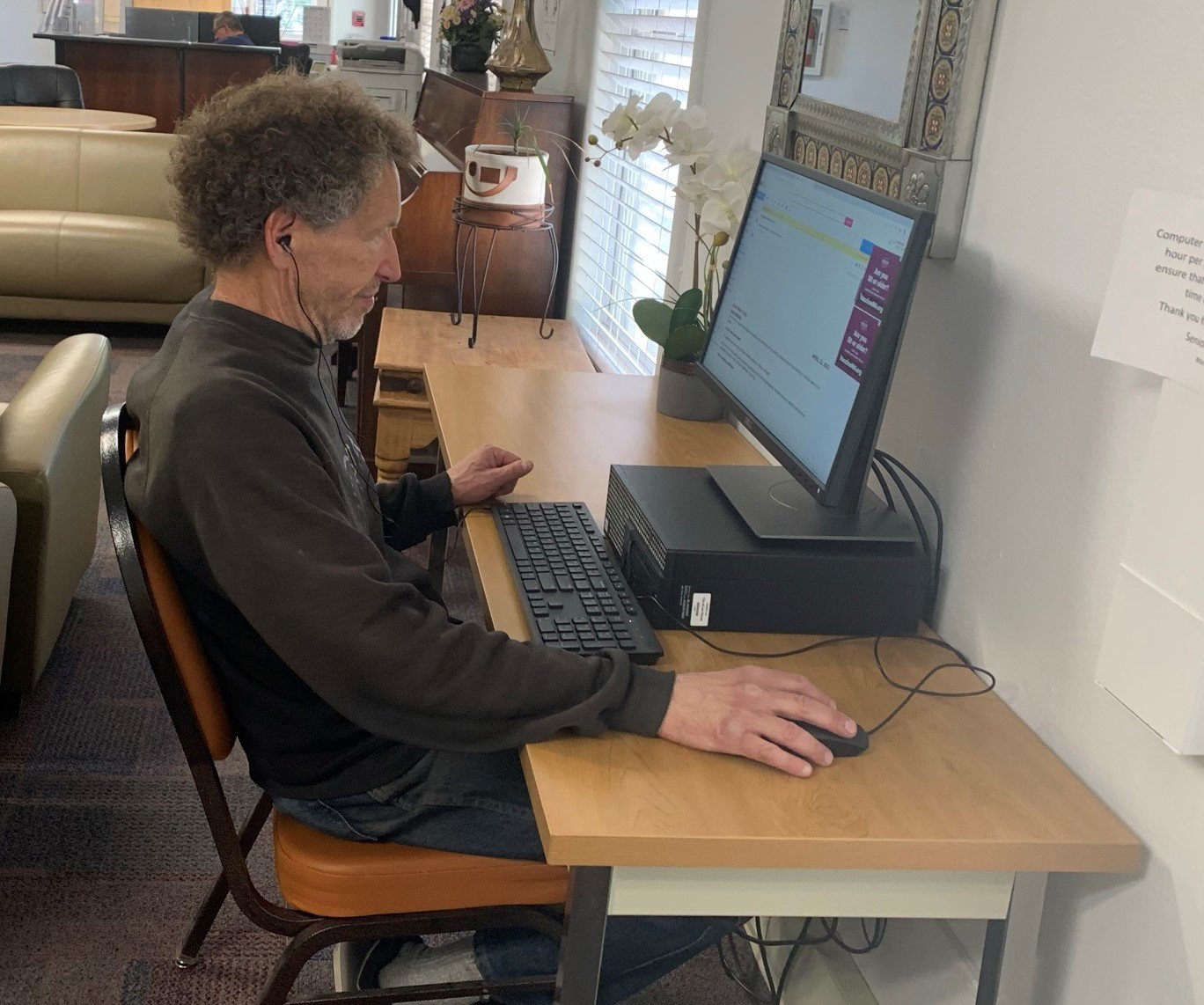 William Kolbin takes advantage of the Internet options at Eastside Senior Community Center on N. Tornillo Street where a Comcast lift zone is available for Wi-Fi connections.