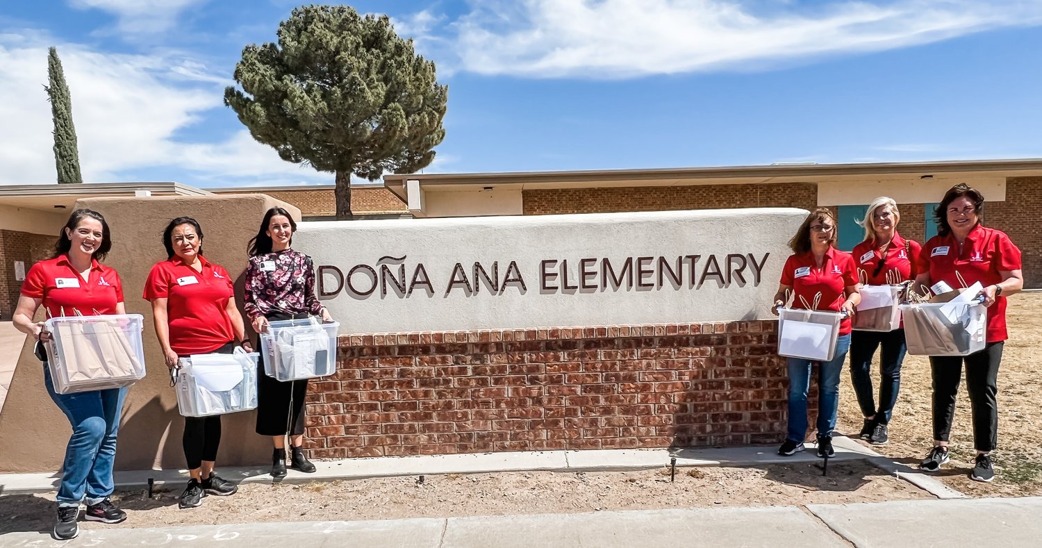 Junior League of Las Cruces members delivering books to Doña Ana Elementary School as part of the league’s “A Book of My Own” program.