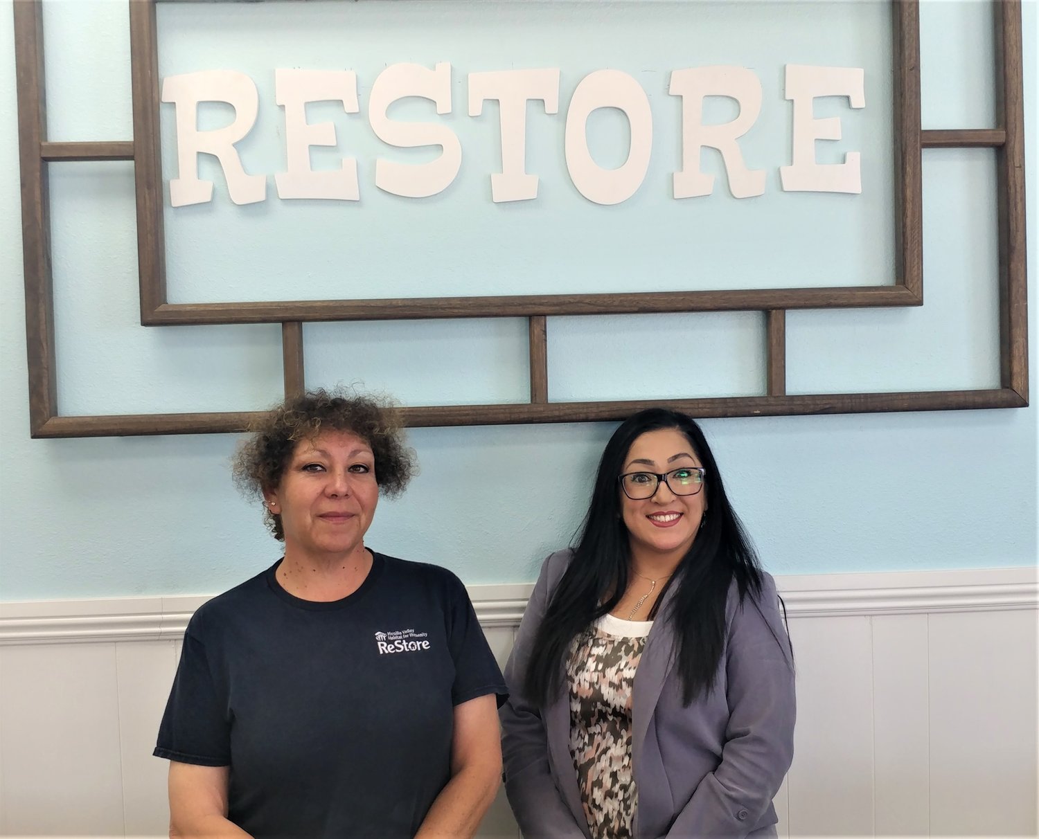 Mesilla Valley Habitat for Humanity Executive Director April Estrada, right, and ReStore Manager Zenaida Medina at the store’s new location.