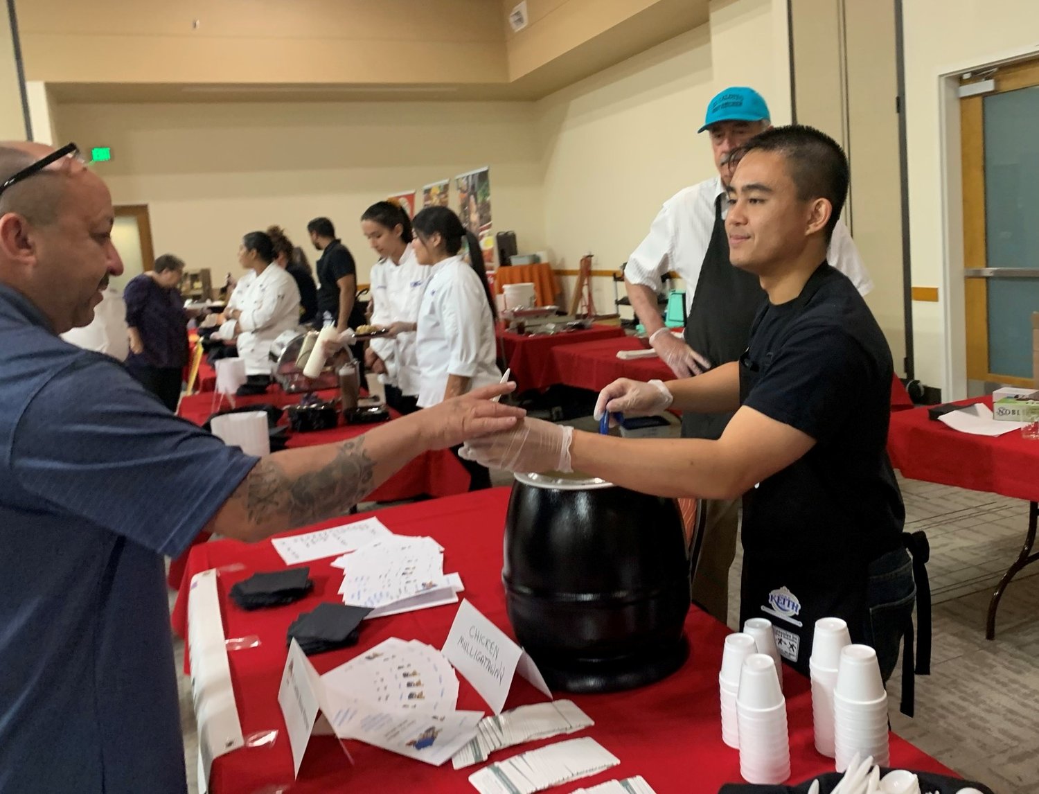 El Caldito Soup kitchen provided chicken mulligatawny soup and, at the next table, the student cooks at Dona Ana Community College created delicious red chile wontons for the Taste of Las Cruces.