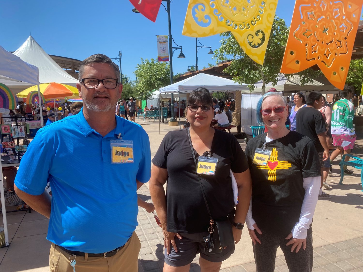 Judges for the 2022 Kids Can Fiesta de la Primavera Youth Market competition included, left to right, Chris Ingalls of Sisbarro Volkswagen, Maria Zuniga of Las Cruces Public Schools and Community Action Agency of Southern New Mexico Board member Nancy Sipes.