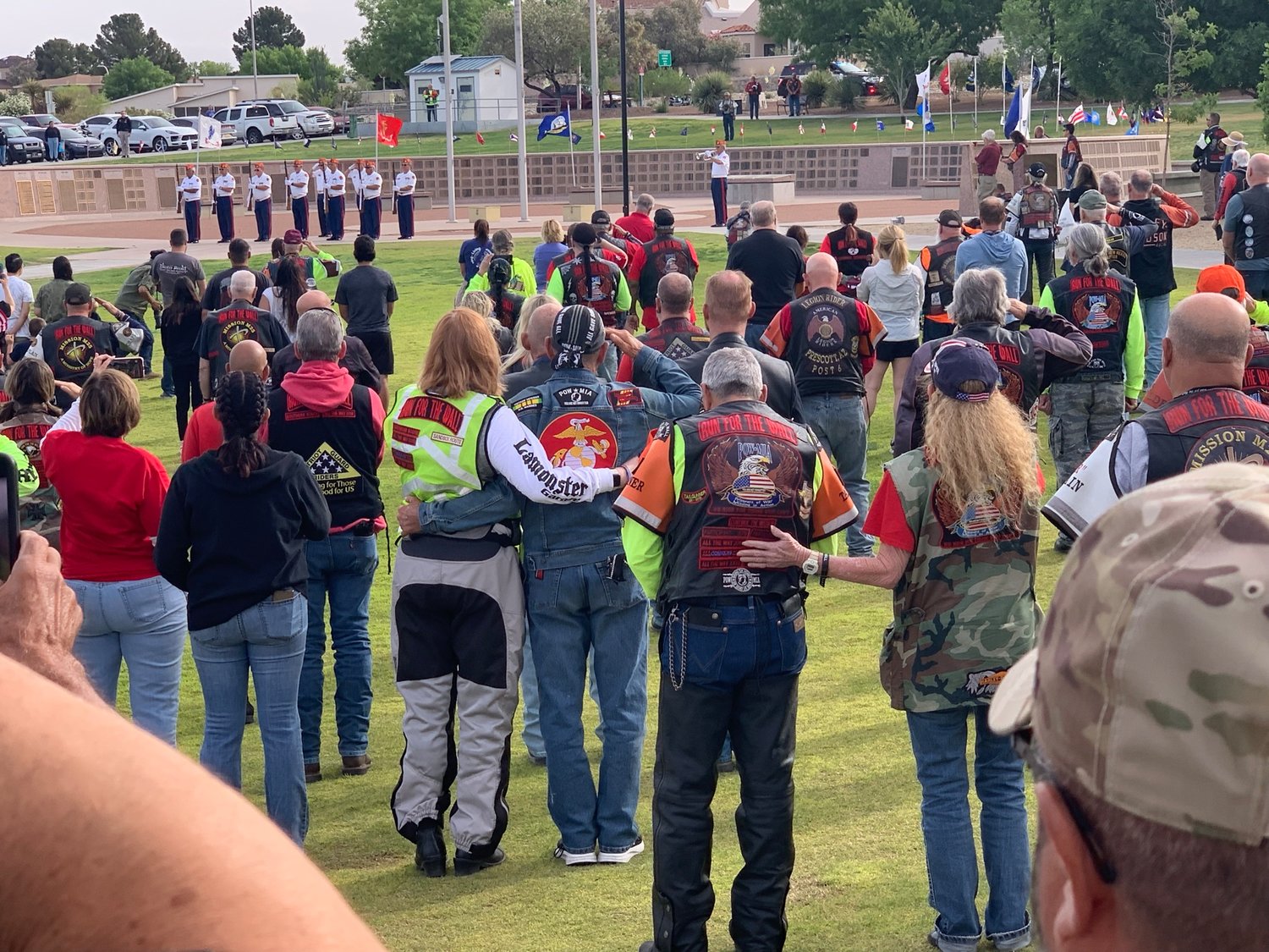The haunting notes of taps float over Las Cruces Veterans Park as participants of the Run for the Wall cross-country motorcycle ride to Washington D.C. turn to honor the flag and say the Pledge of Allegiance.