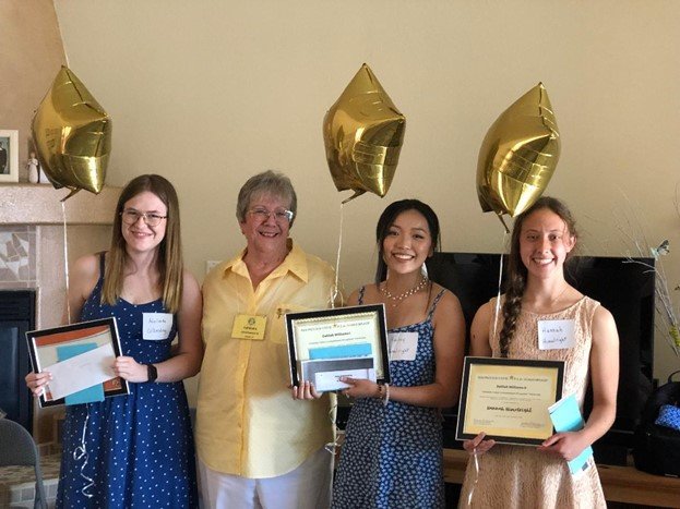 Honored at a May 7 reception held in their honor, Chapter AS P.E.O. scholarship recipients are Adelaide Olberding, Hailey Himelright and Hannah Himelright.  Second from left is Chapter AS P.E.O. scholarship chair Lenora Oesterreich.