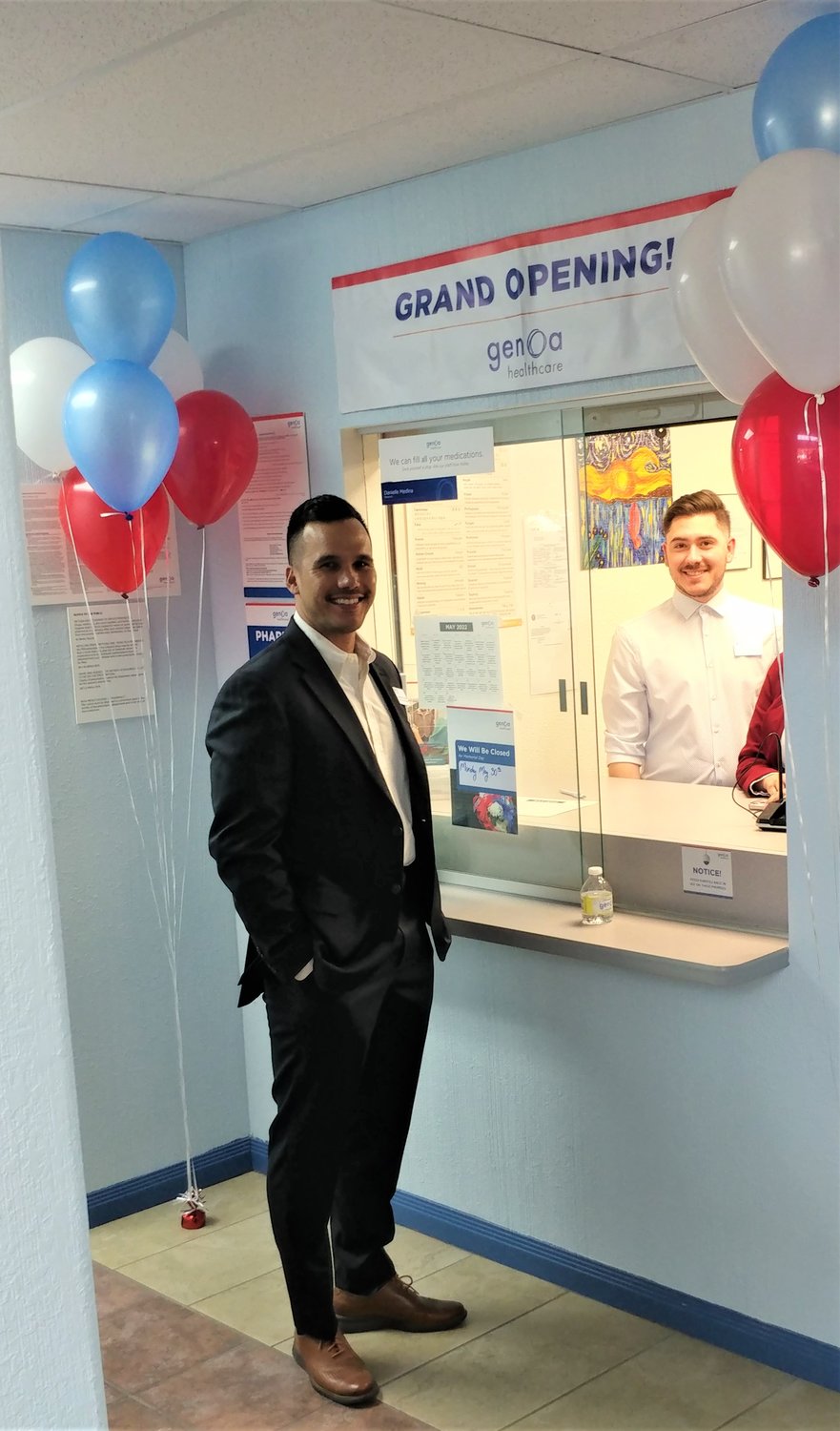 Genoa Director of Pharmacy Operations in New Mexico and southern Arizona Joey Pelierito at the new pharmacy window at Southwest Counseling Center.