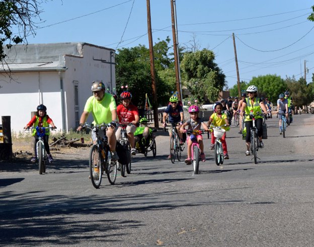 League of American Bicyclists League Cycling Instructor George Pearson, and Las Cruces Public Schools Safe Routes to Schools Coordinator Ashleigh Curry guide participants on a 1-mile loop thru the Town of Mesilla during the first annual Every Body Rides with Grace Adaptive Cycle Parade.