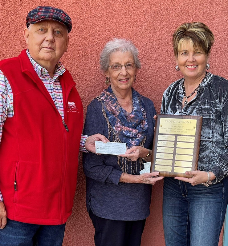 The Progress Club of Las Cruces becomes a proud patron of Thomas Branigan Memorial Library with this $1,000 donation. Left to right are Thomas Brannigan Public Library Board President Dennis Cherry and Progress Club members Jo Banks and Debbie McAllen.