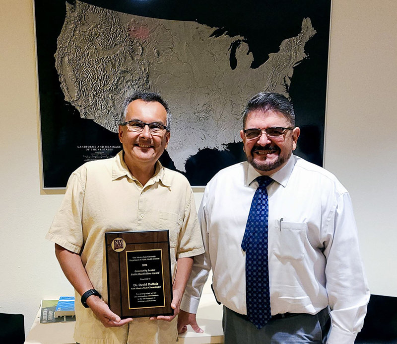 State climatologist for New Mexico David DuBois, left, received the Community Leader Public Health Hero Award from Héctor Luis Díaz, head of NMSU’s Department of Public Health Sciences.