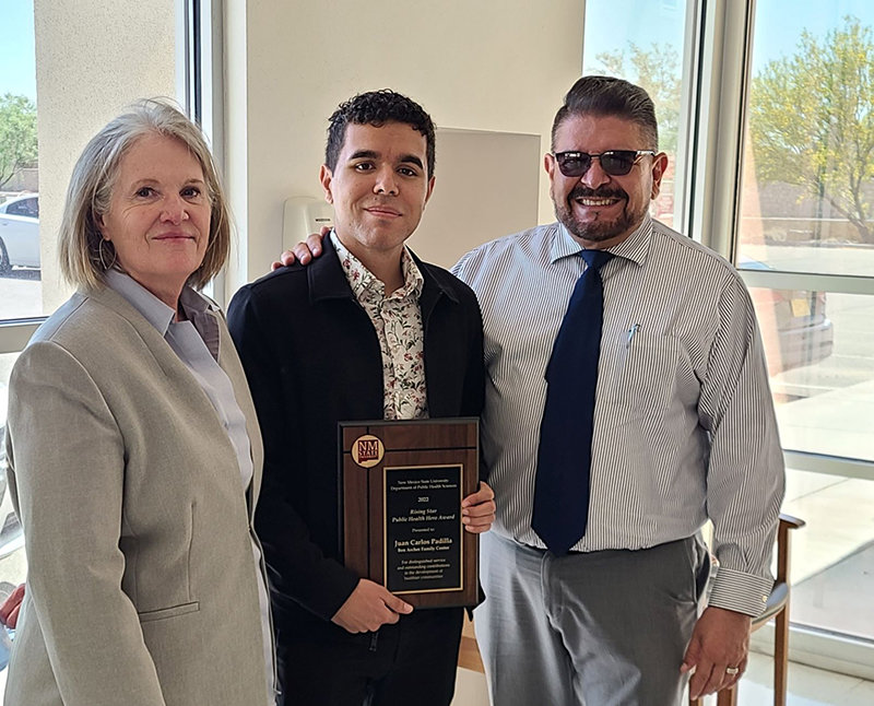 Juan Carlos Padilla of Ben Archer Health Center, center, received the Rising Public Health Hero Award from New Mexico State University’s Department of Public Health Sciences. At left is Frances Scappaticci, also of Ben Archer Health Center, and Héctor Luis Díaz, head of NMSU’s Department of Public Health Sciences.