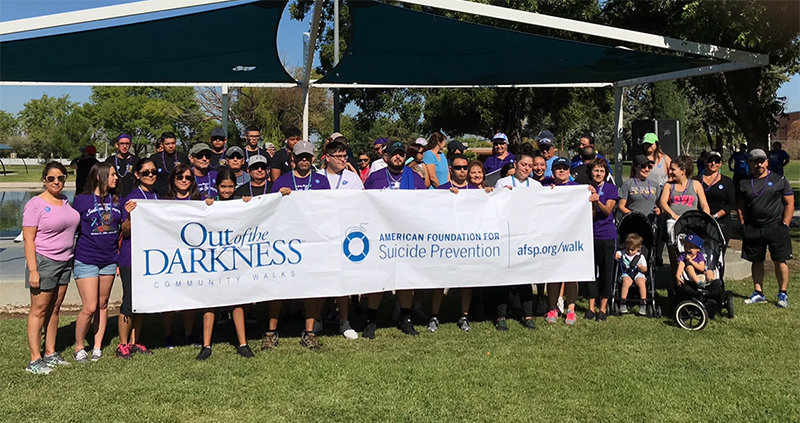 Photos are of previous American Foundation for Suicide Prevention Las Cruces Out of Darkness Walks.