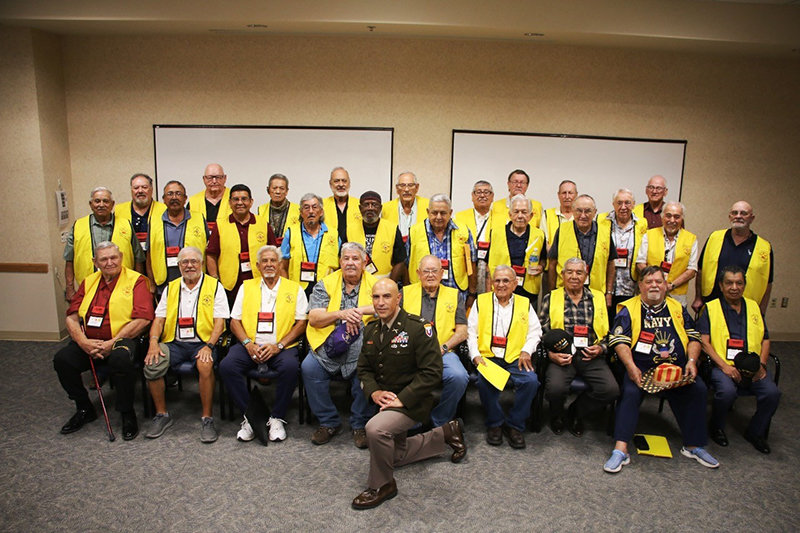 The 2022 Honor Flight veterans gather for a preflight meeting. In front of the veterans is Col. Jim Brady, commander of the U.S. Army Garrison at Fort Bliss.