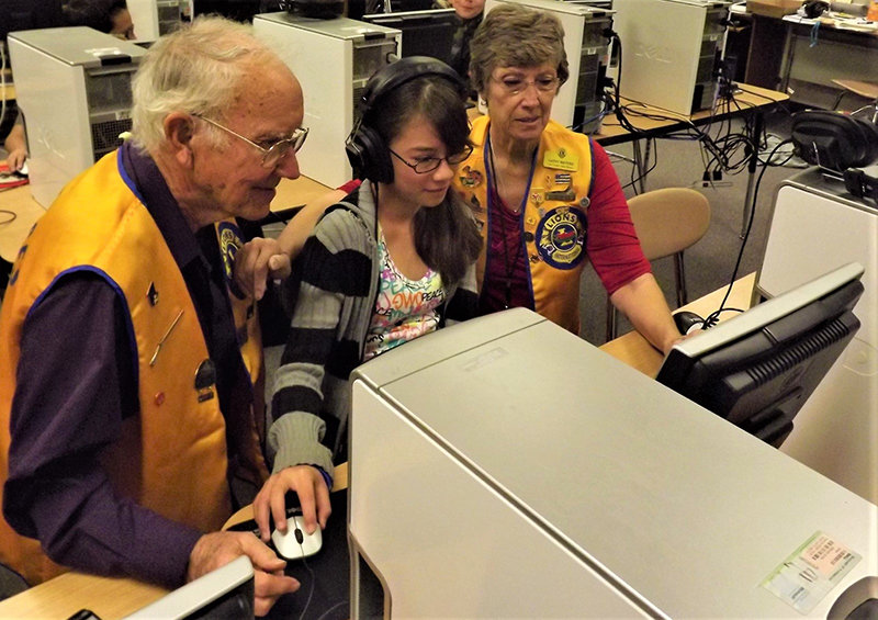 Lions Club members conducting a student vision screening.