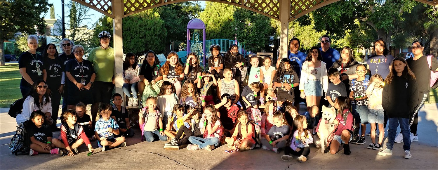 Central Elementary School students, staff and parents in the gazebo at Pioneer Women’s Park getting ready for their walk to school Friday morning, Sept. 23. The husky’s name is Zoe.